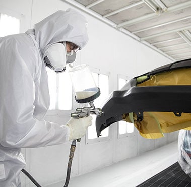 Collision Center Technician Painting a Vehicle | Koons Toyota of Tysons in Vienna VA