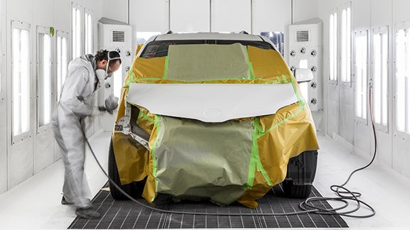 Collision Center Technician Painting a Vehicle | Koons Toyota of Tysons in Vienna VA