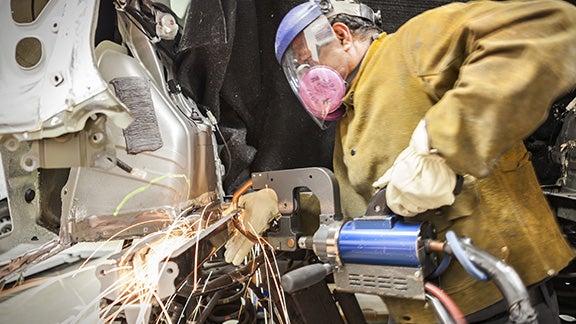 Collision Center Technician Repairing Vehicle | Koons Toyota of Tysons in Vienna VA